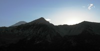 Rainier and sun hiding