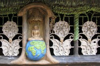 Buddha sitting on top of the world