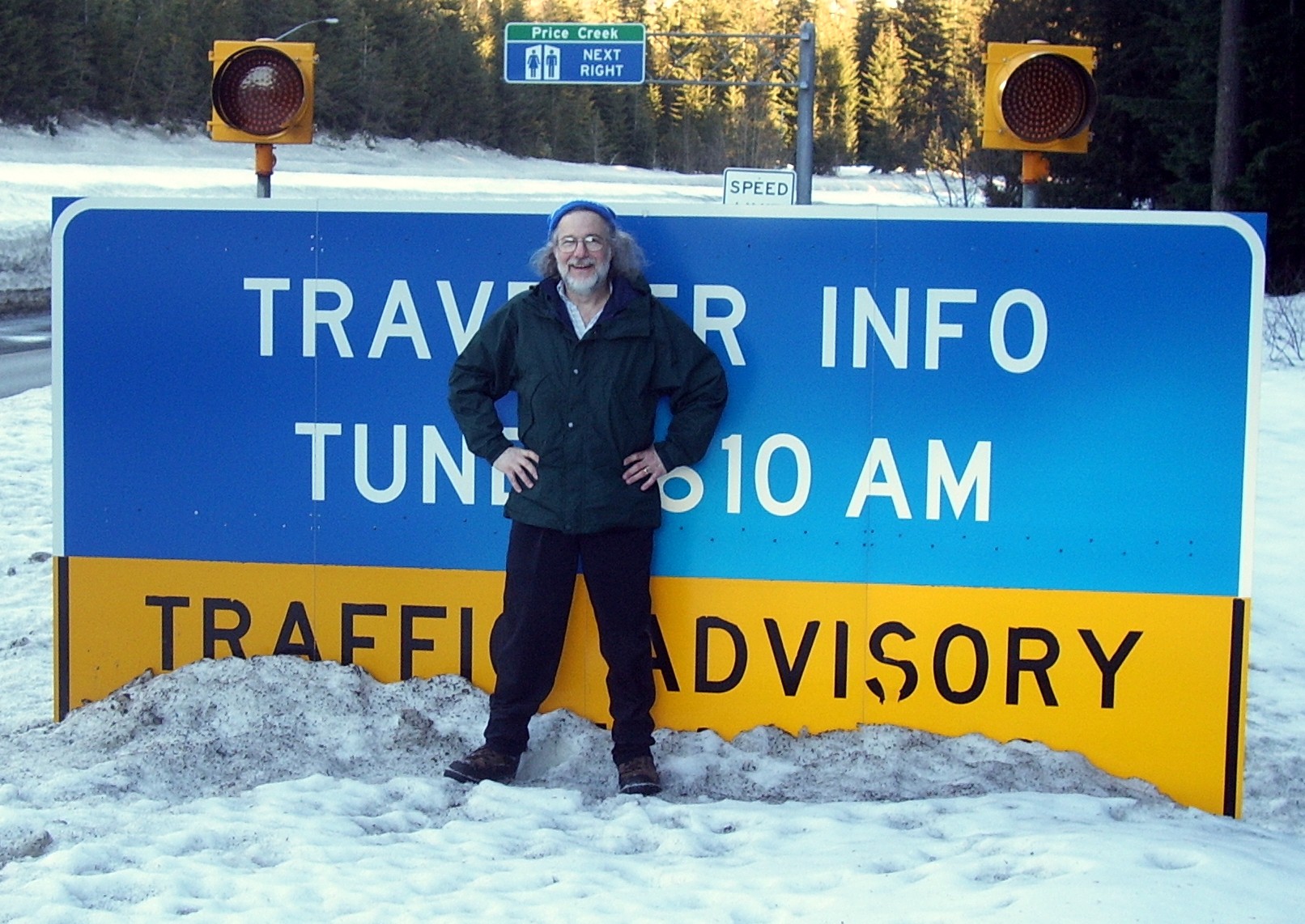 Alex by snowy price creek freeway sign