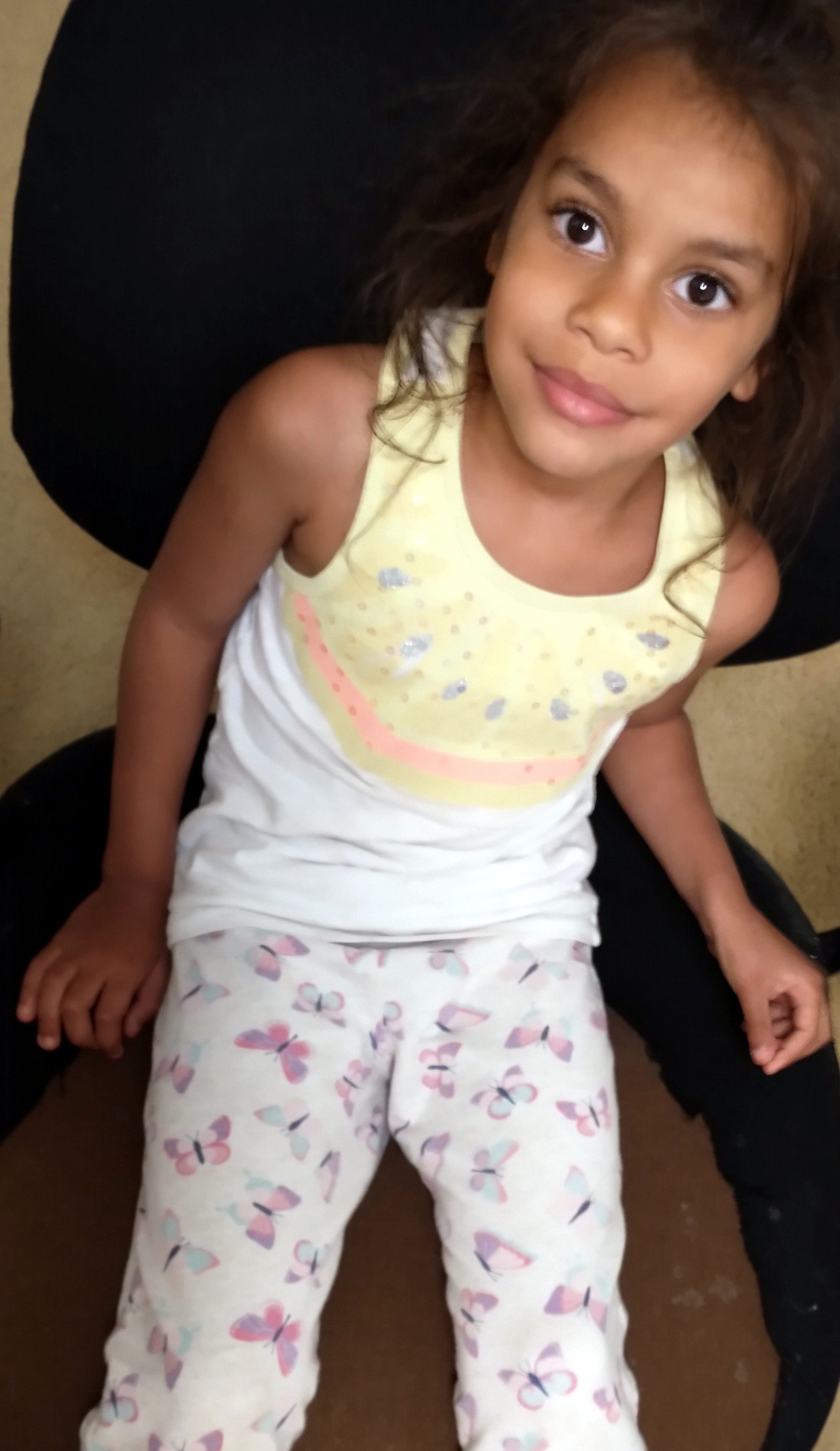 Olive in computer room chair