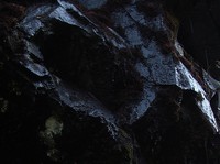 dark wet rock not a hole