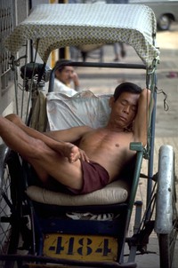 Hong Kong pedicab driver sleeping 1970