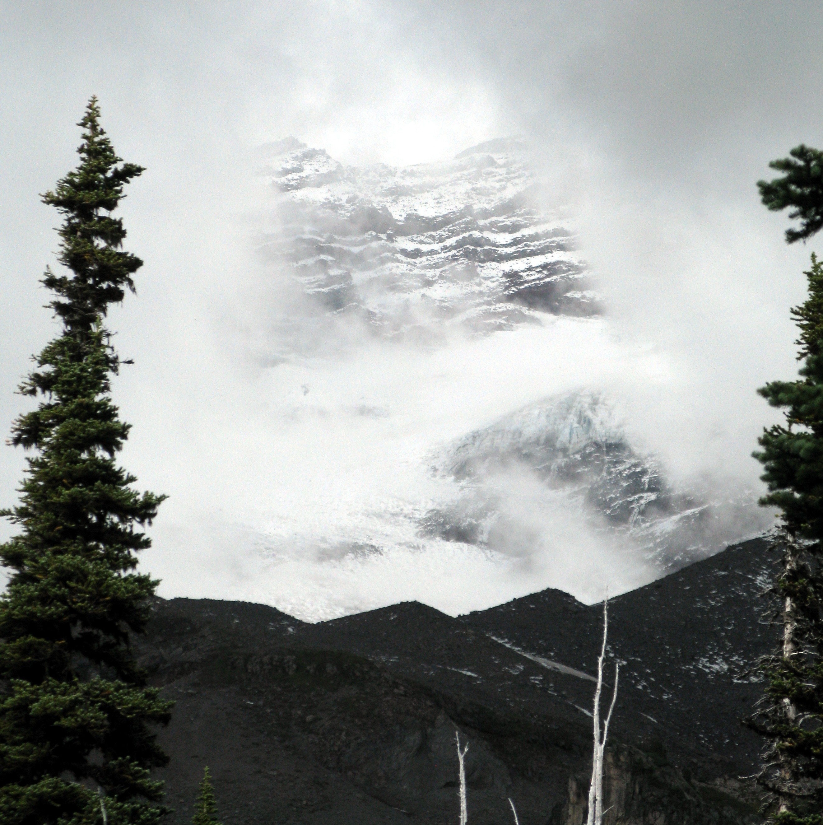 Mt Rainier wall behind the clouds