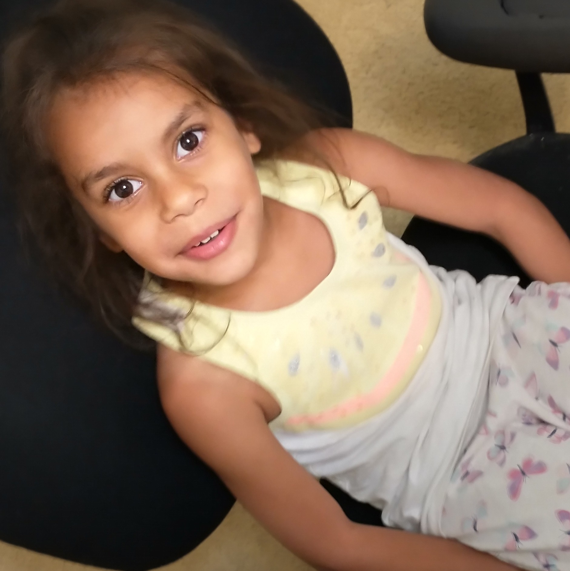 Olive in computer room chair