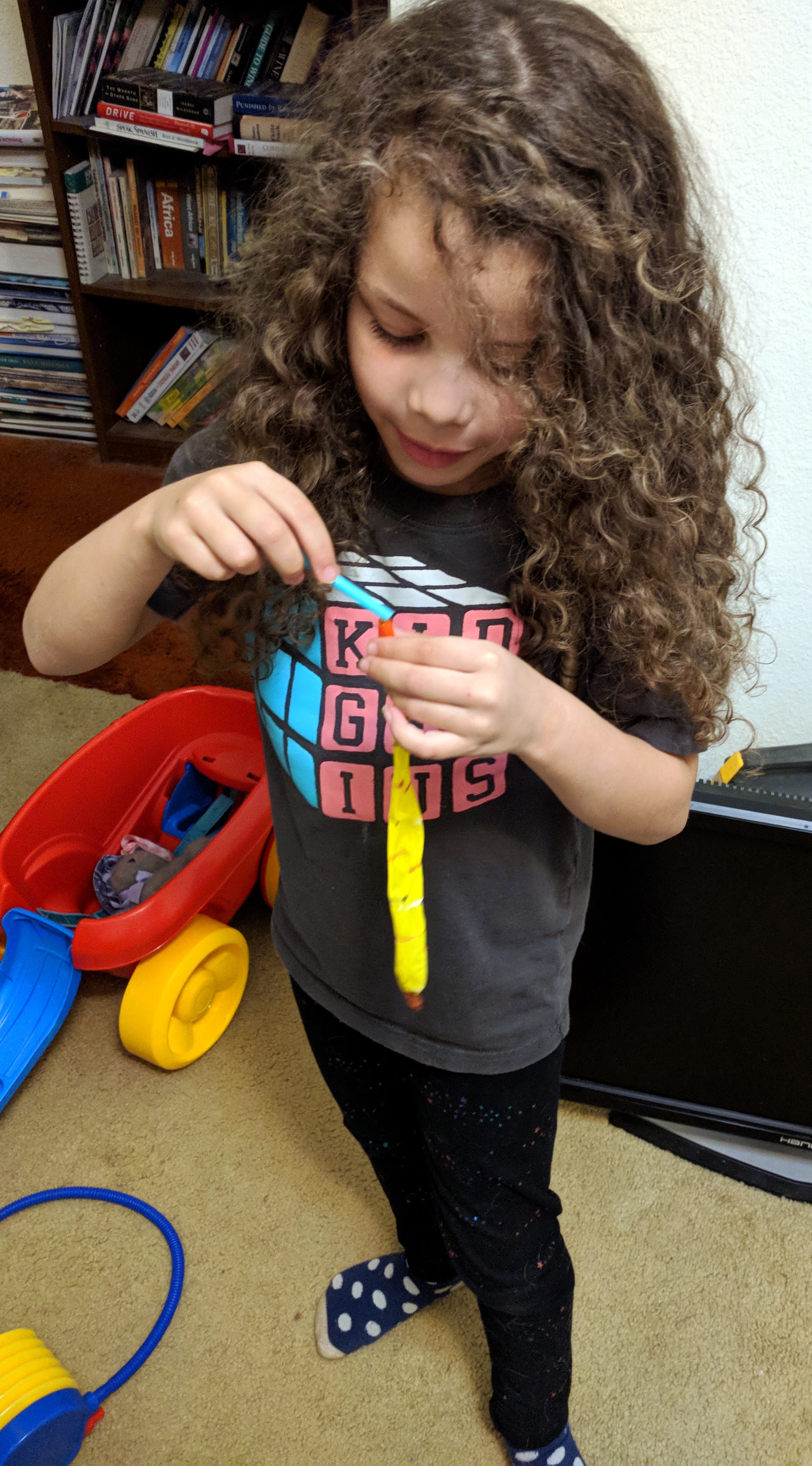 Zoey blowing balloon